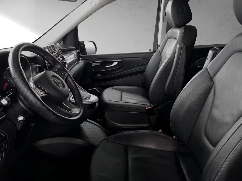 Front cabin of the Mercedes-Benz V-Class with leather seats and wood trim